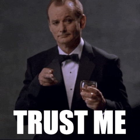 Meme of Bill Murray in a tux with a drink in onw hand, pointing at the camera with the text TRUST ME.